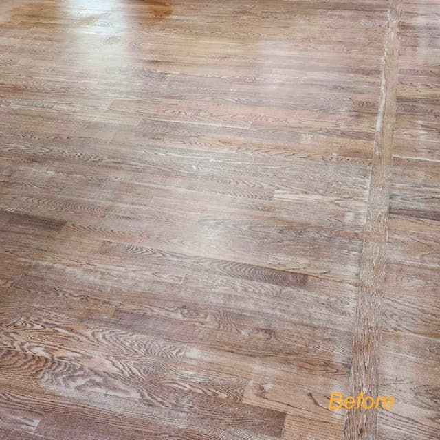 Oak floor with visible transition seam — before treatment