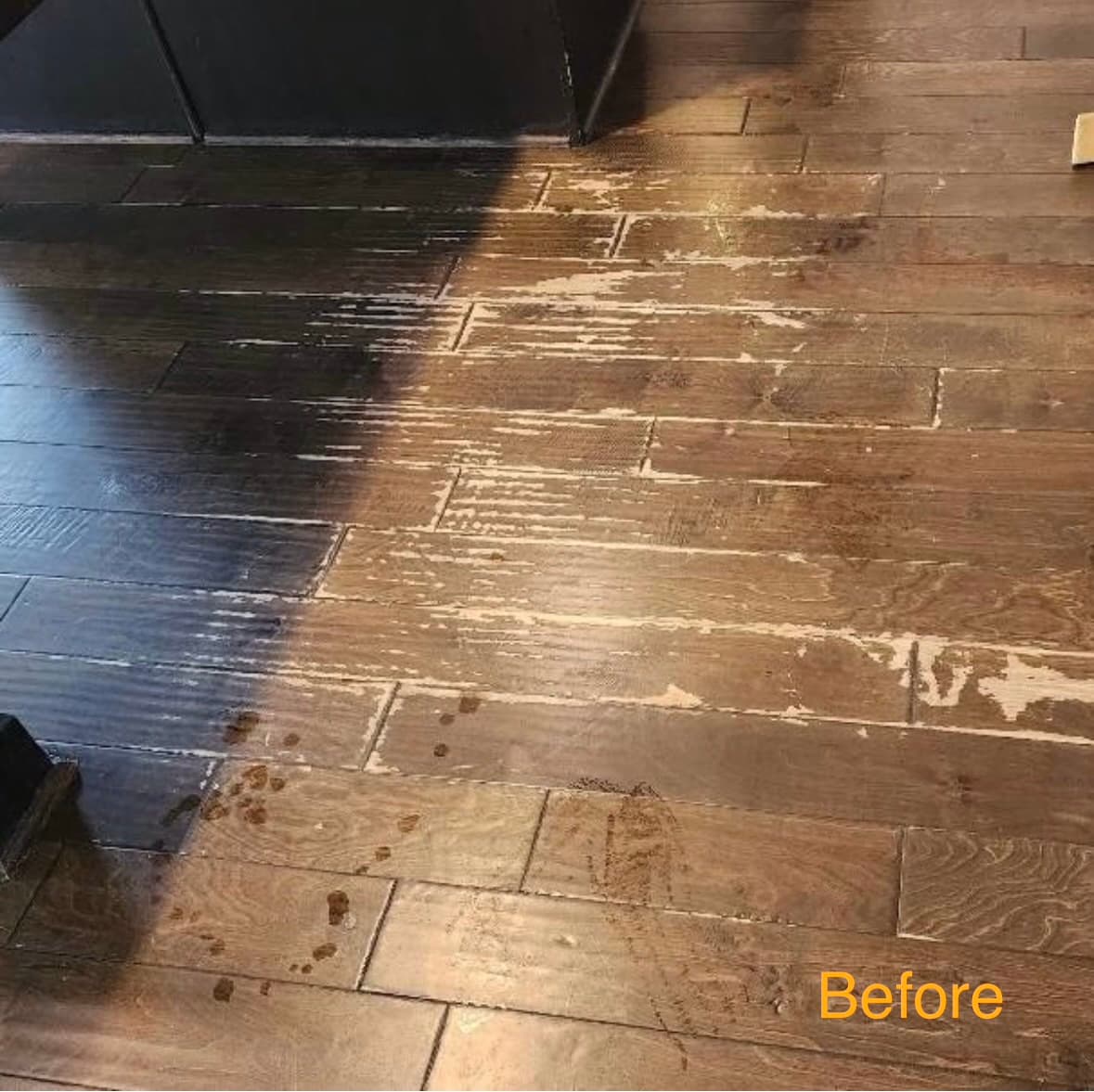 Dark hardwood floor — severely scraped before restorative refinish